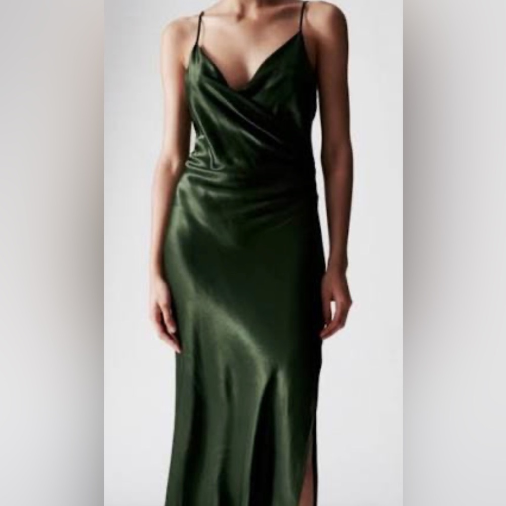 This is a green emerald long Zara dress with silk like material